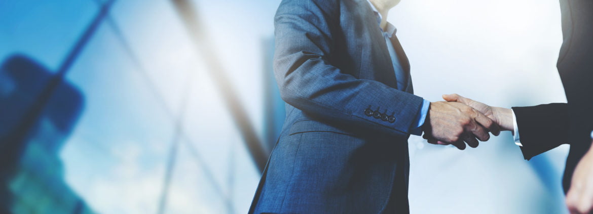 businessmen handshake business meeting and partnership concept | eClouds Salesforce Consultants Developers in New York